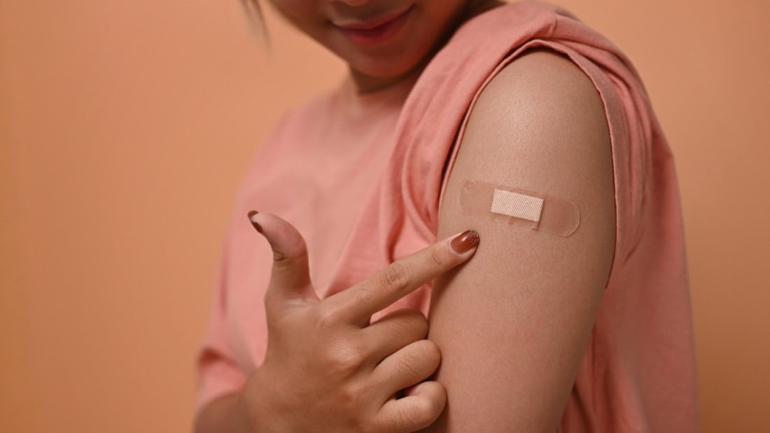 Skin prick vaccination on arm for travel and vaccinations, healthcare, immunisation.